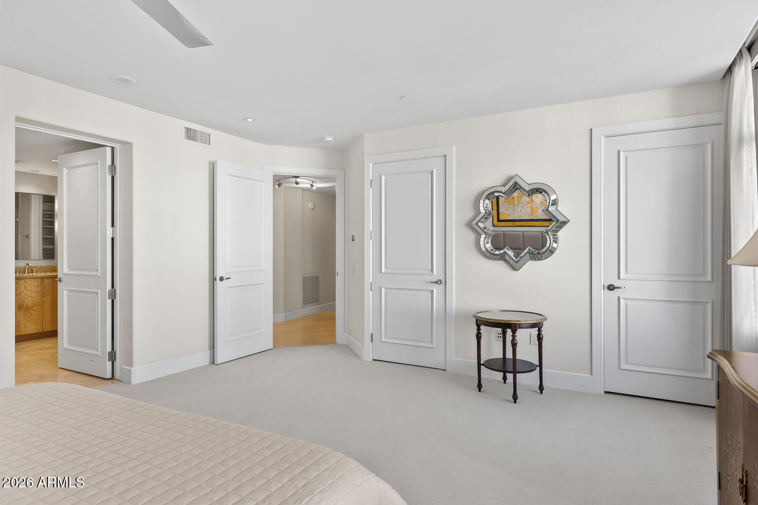 2402 East Esplanade Lane, Unit 704 Phoenix, AZ 85016 - Photo 32 of 42 a bedroom with a bed and a cabinets