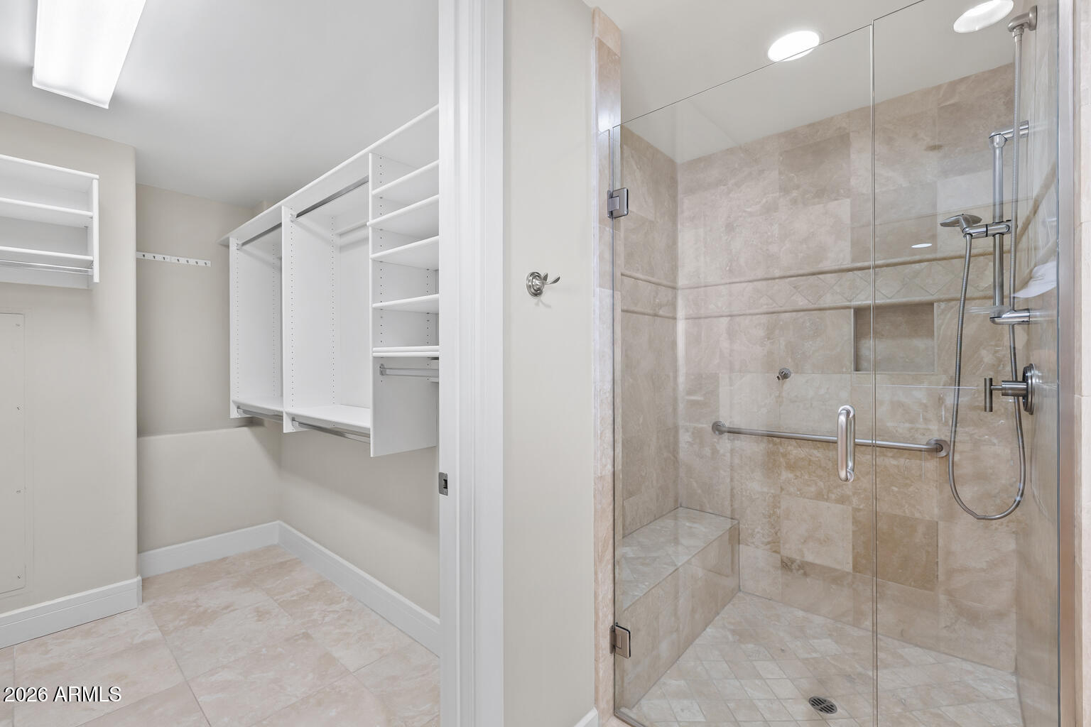 2402 East Esplanade Lane, Unit 704 Phoenix, AZ 85016 - Photo 34 of 42 a bathroom with a shower and a glass door