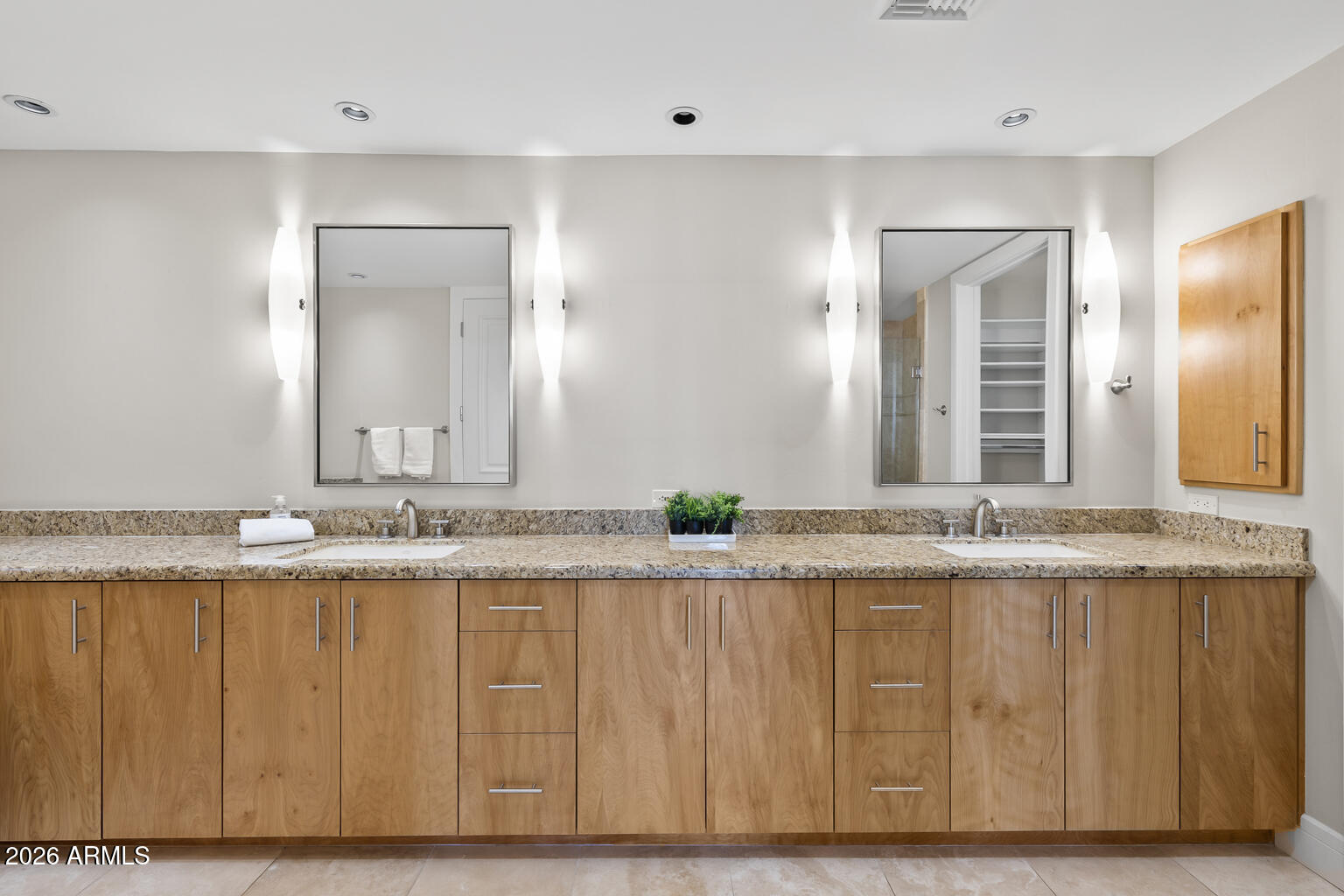 2402 East Esplanade Lane, Unit 704 Phoenix, AZ 85016 - Photo 35 of 42 a bathroom with a granite countertop sink and a mirror
