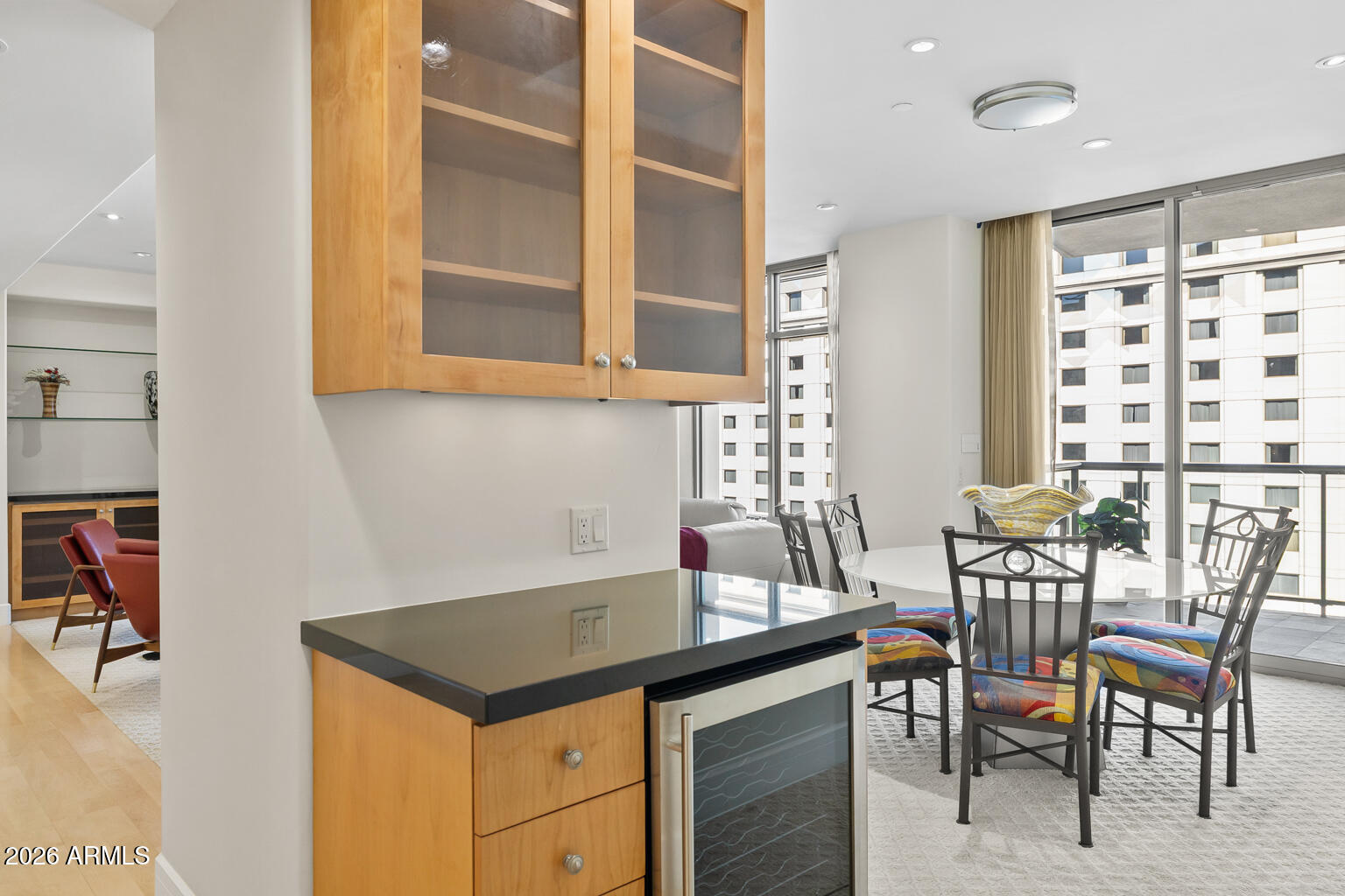 2402 East Esplanade Lane, Unit 704 Phoenix, AZ 85016 - Photo 4 of 42 a kitchen that has a table and chair in it