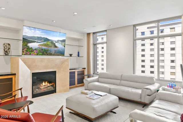 a living room with furniture and a fireplace