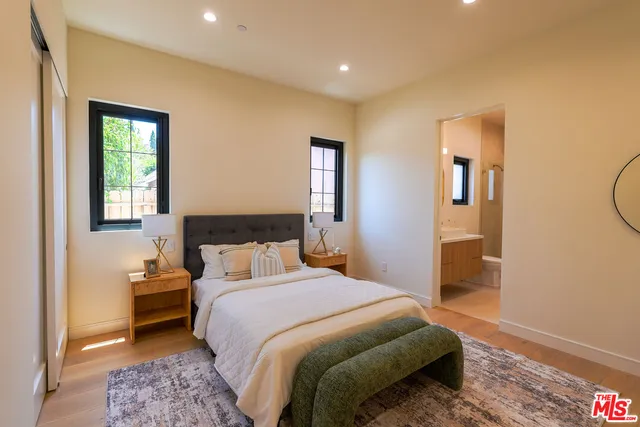 a bedroom with a bed and furniture