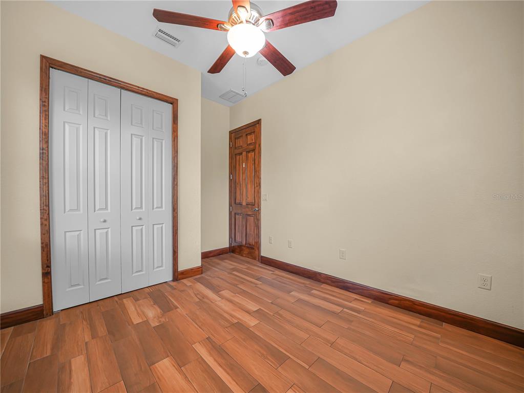 100 Reedy Creek Drive Frostproof, FL 33843 - Photo 21 of 36 wooden floor in an empty room