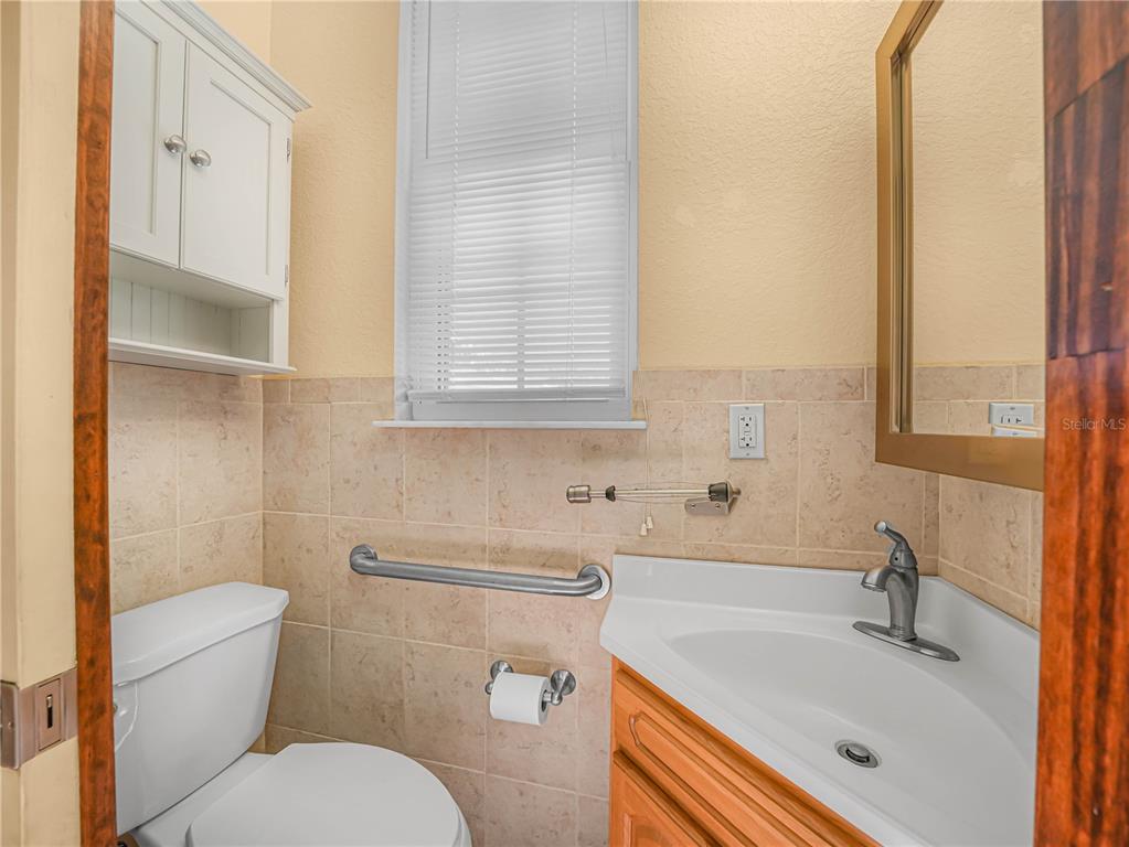 100 Reedy Creek Drive Frostproof, FL 33843 - Photo 23 of 36 a bathroom with a sink toilet and shower