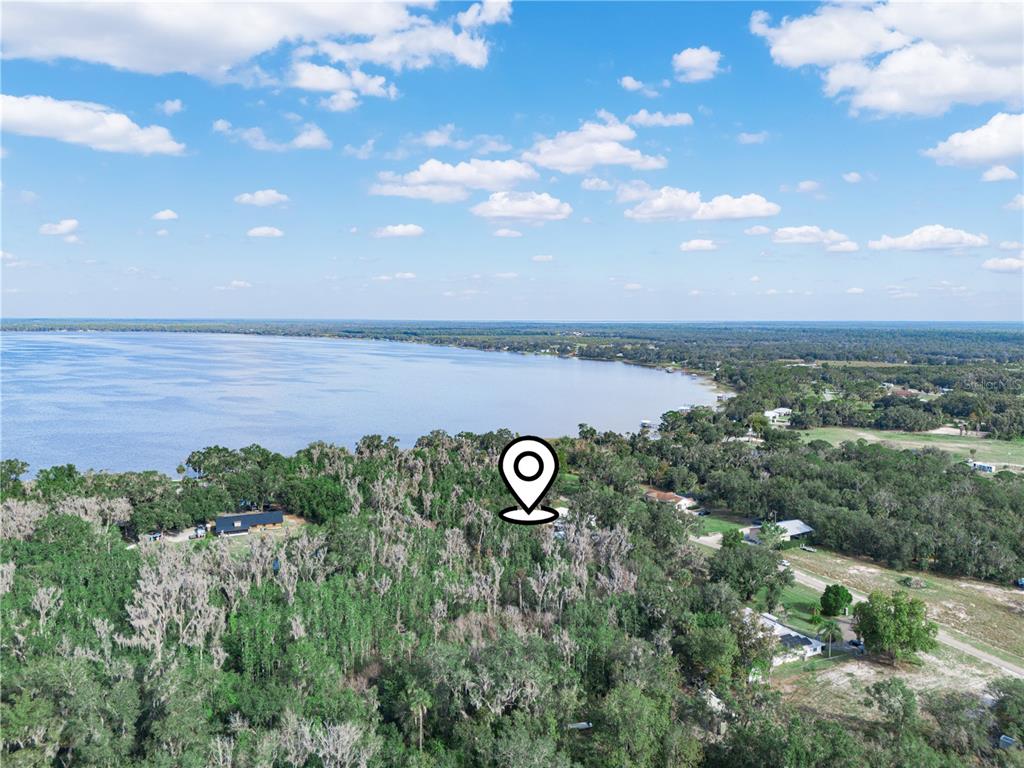 100 Reedy Creek Drive Frostproof, FL 33843 - Photo 36 of 36 a view of a lake from a yard