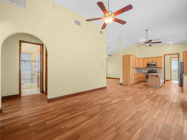 a view of a room with wooden floor