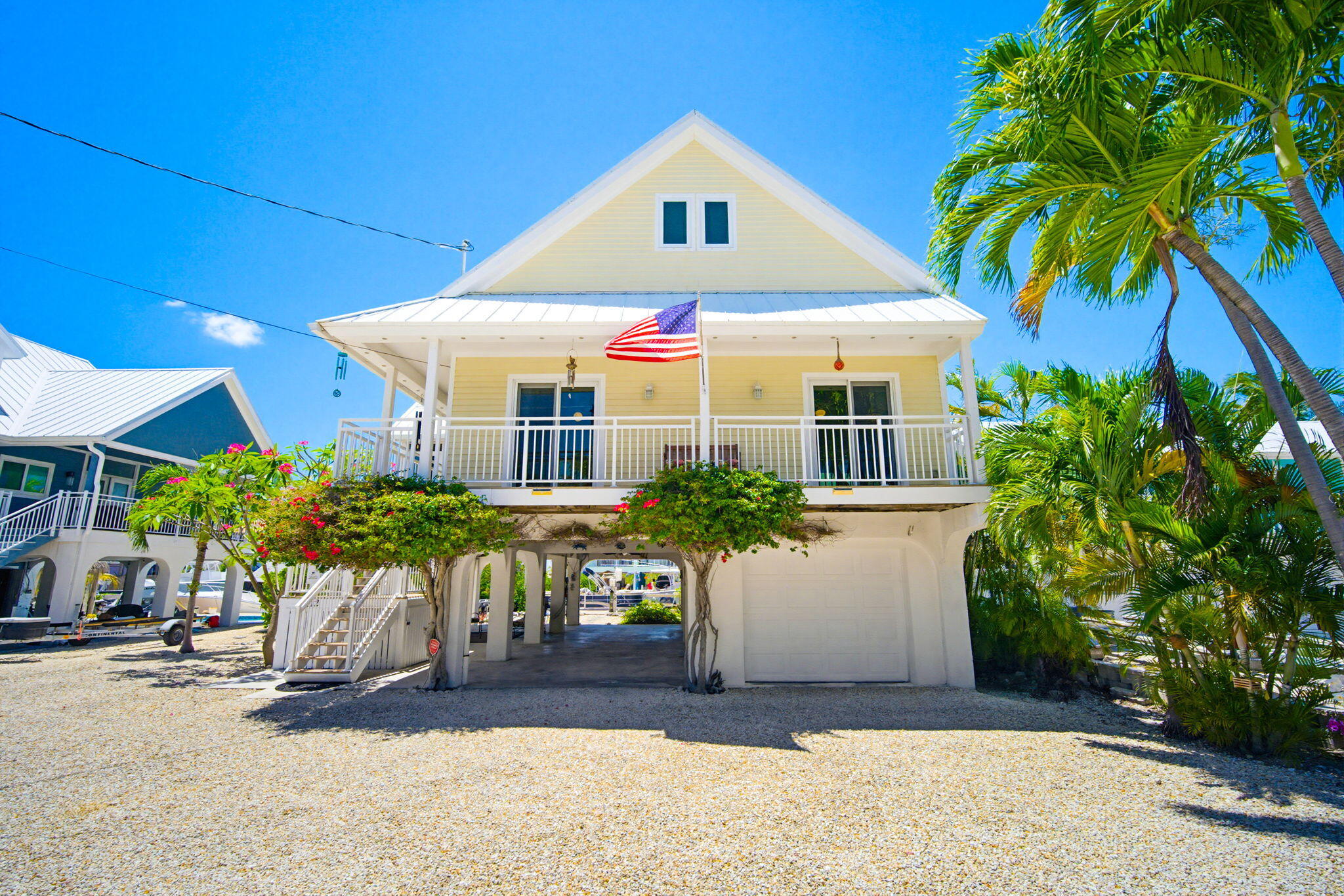 612 Blackbeard Road Summerland Key, FL 33042 - Photo 4 of 68 a front view of a house with porch and furniture