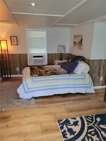 a living room with furniture and a lamp