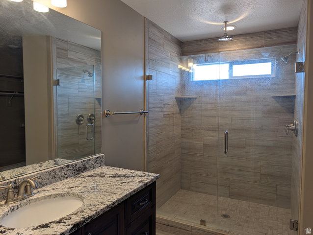 171 South Mustang Road East Grantsville, UT 84029 - Photo 14 of 41 Spacious shower with glass enclosure, rain shower head, and horizontal transom window