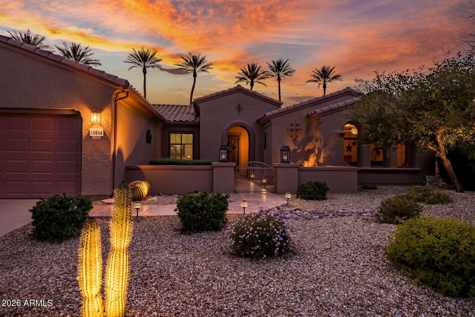19848 North Rawhide Way Surprise, AZ 85387 - Photo 1 of 61 a front view of a house with a yard