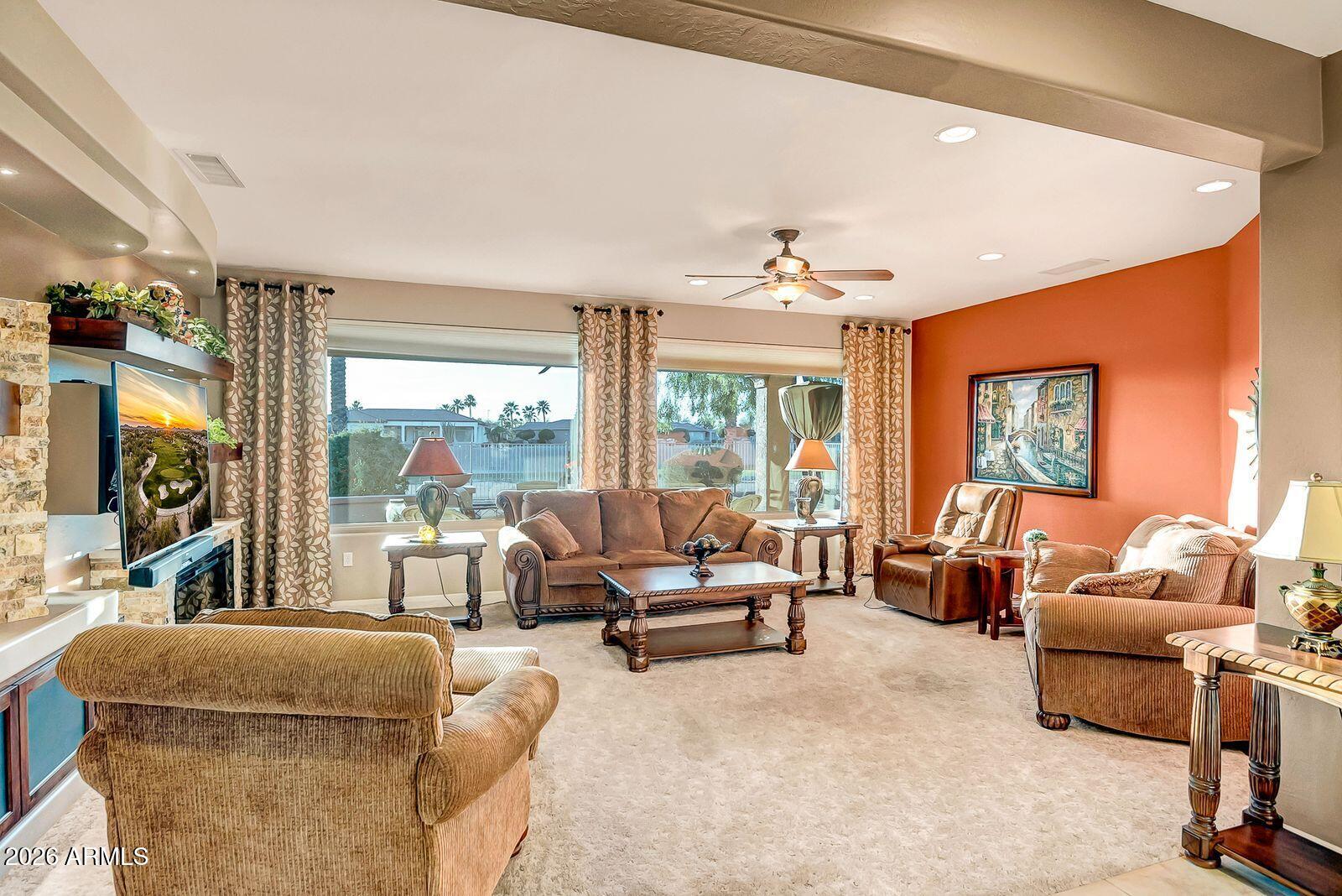 19848 North Rawhide Way Surprise, AZ 85387 - Photo 16 of 61 a living room with furniture and a large window