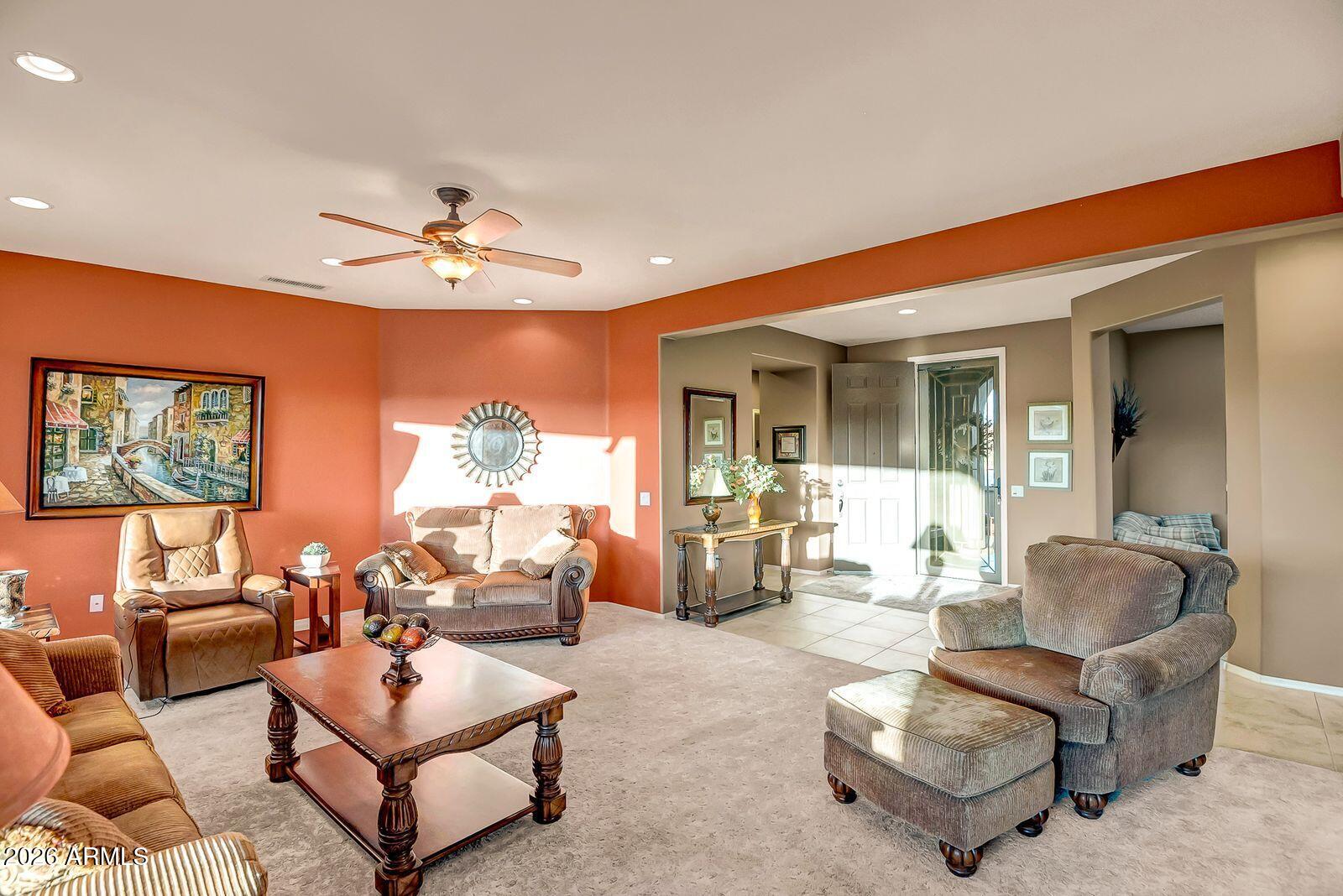 19848 North Rawhide Way Surprise, AZ 85387 - Photo 17 of 61 a living room with furniture and a chandelier