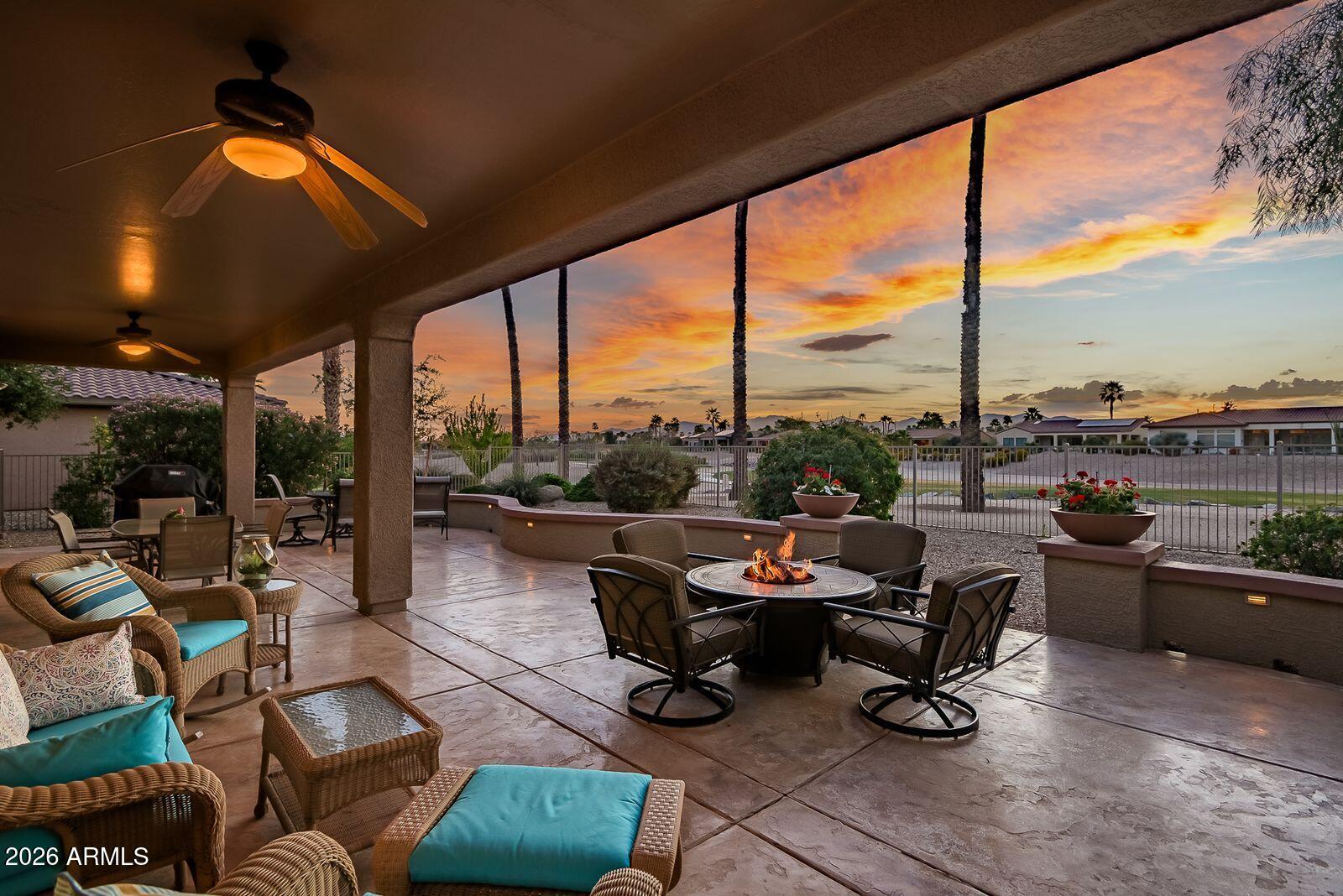 19848 North Rawhide Way Surprise, AZ 85387 - Photo 37 of 61 a living room with patio furniture and a floor to ceiling window