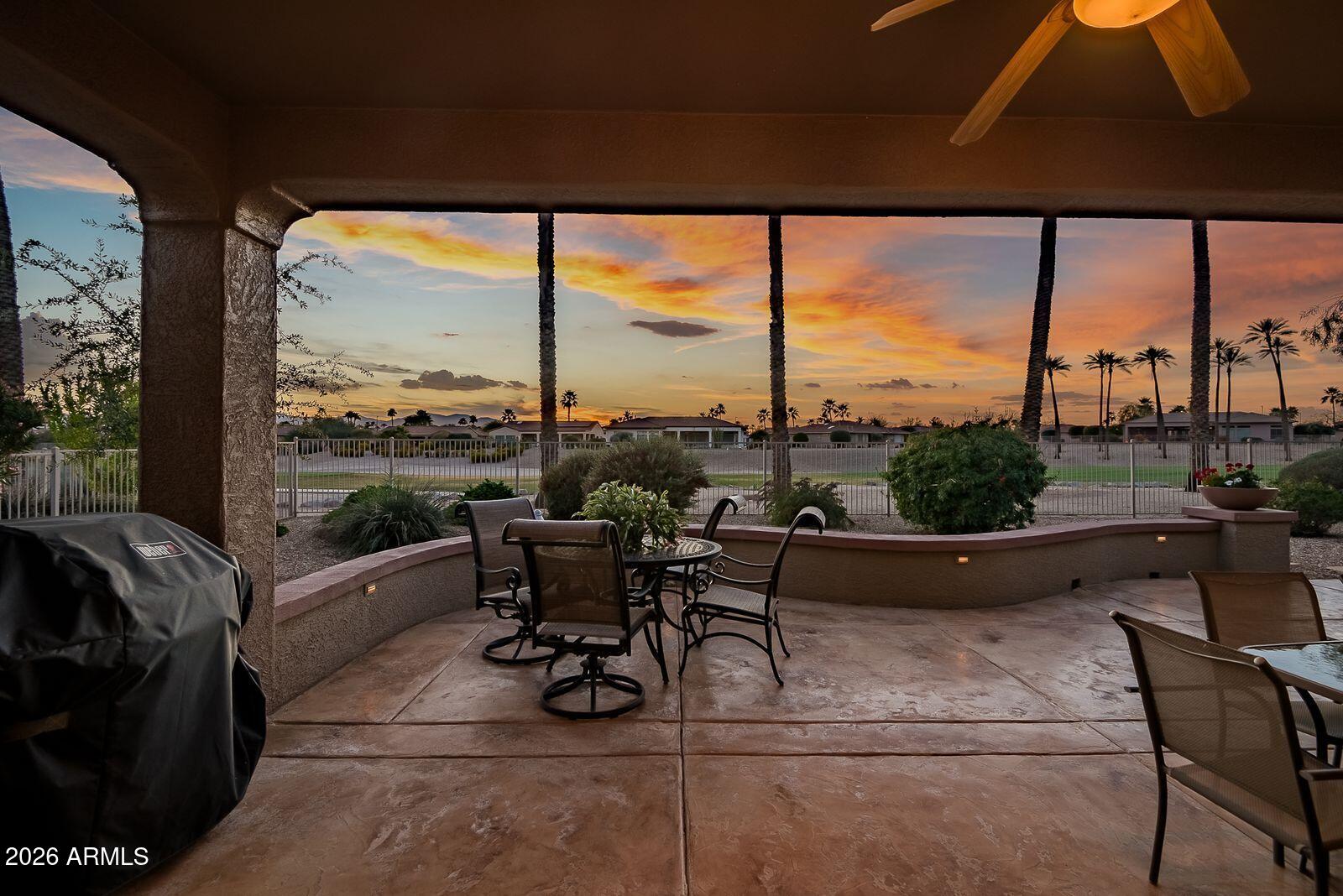 19848 North Rawhide Way Surprise, AZ 85387 - Photo 40 of 61 a living room with furniture and a floor to ceiling window