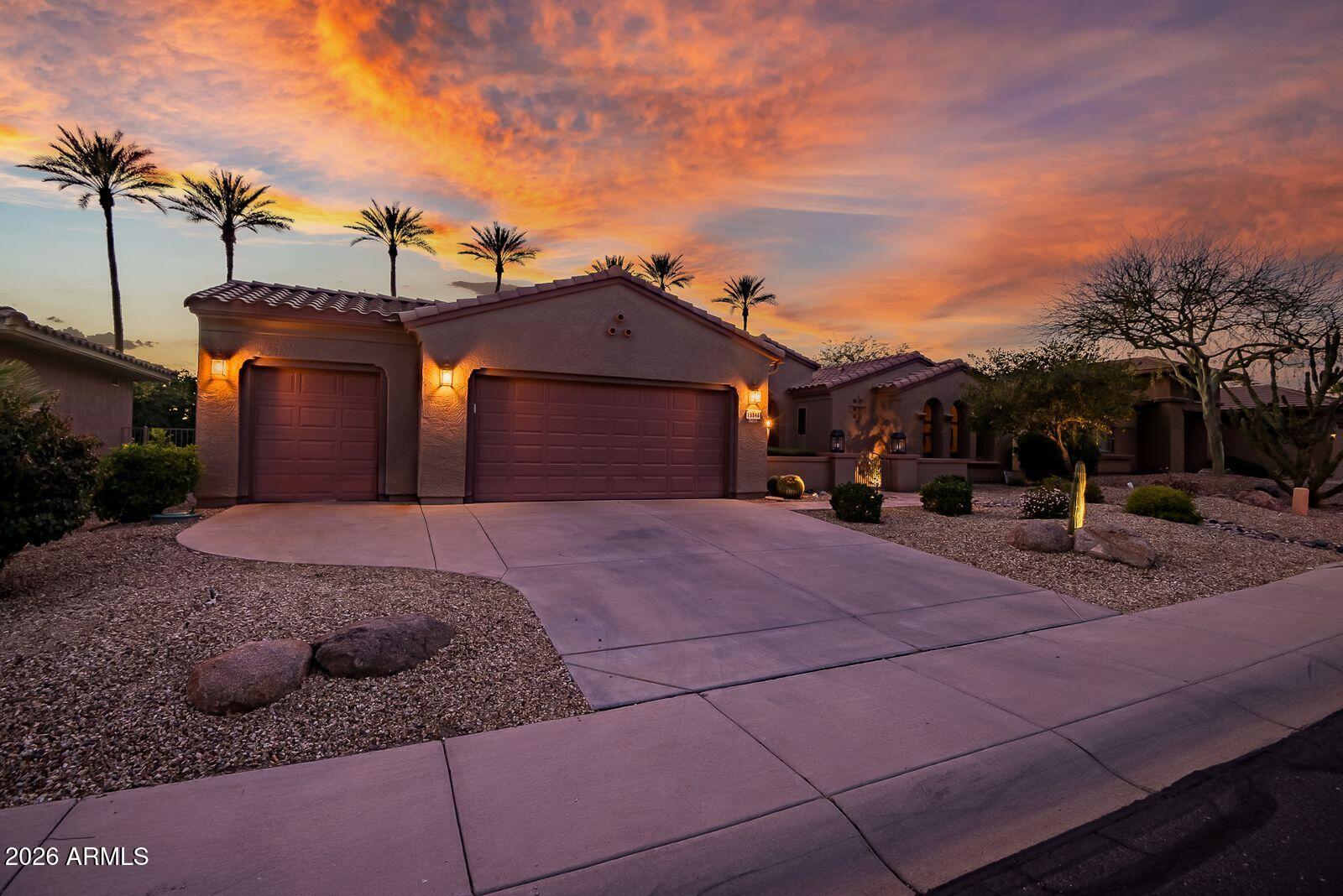 19848 North Rawhide Way Surprise, AZ 85387 - Photo 4 of 61 a front view of a house with a yard