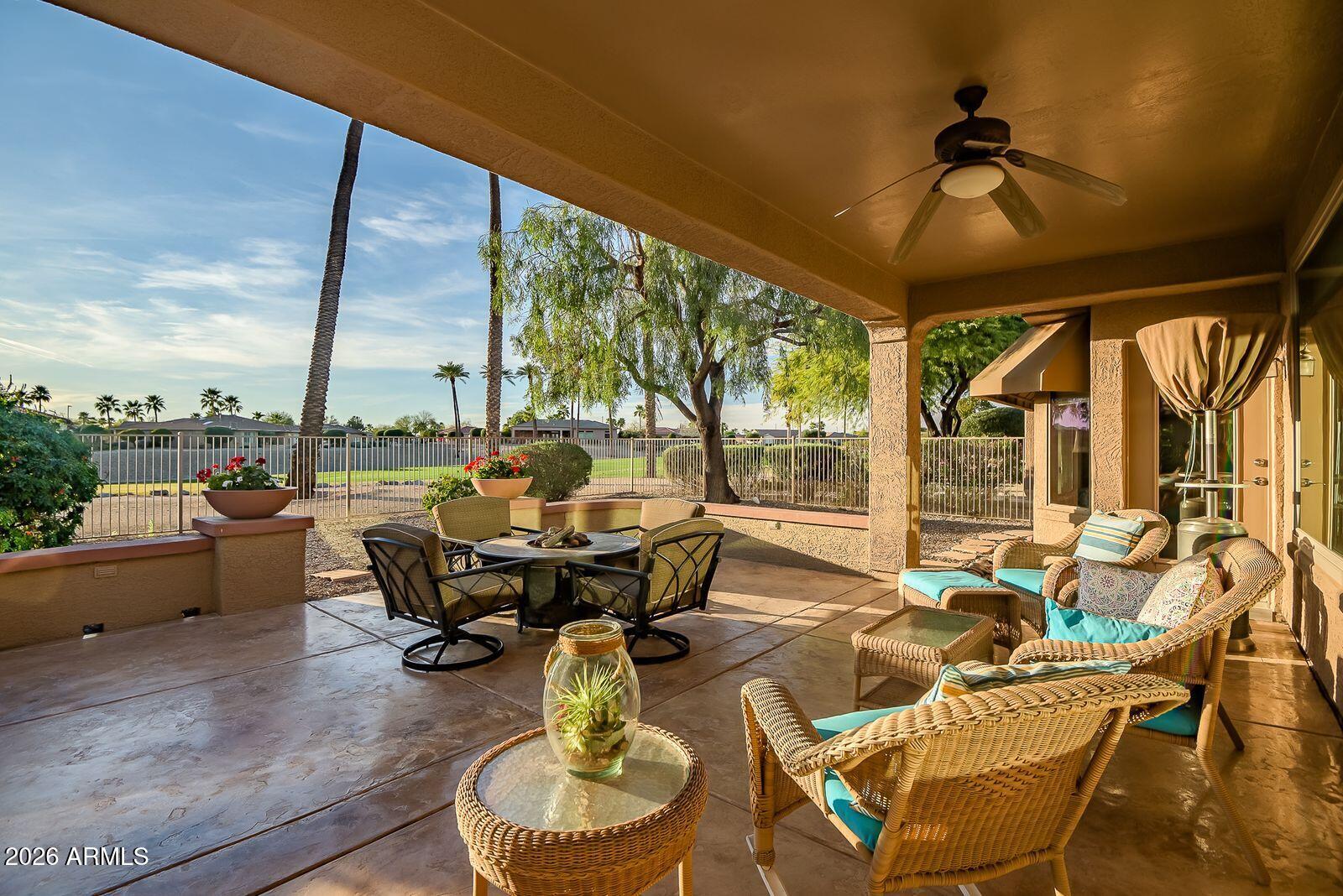 19848 North Rawhide Way Surprise, AZ 85387 - Photo 48 of 61 a living room with patio furniture and a floor to ceiling window