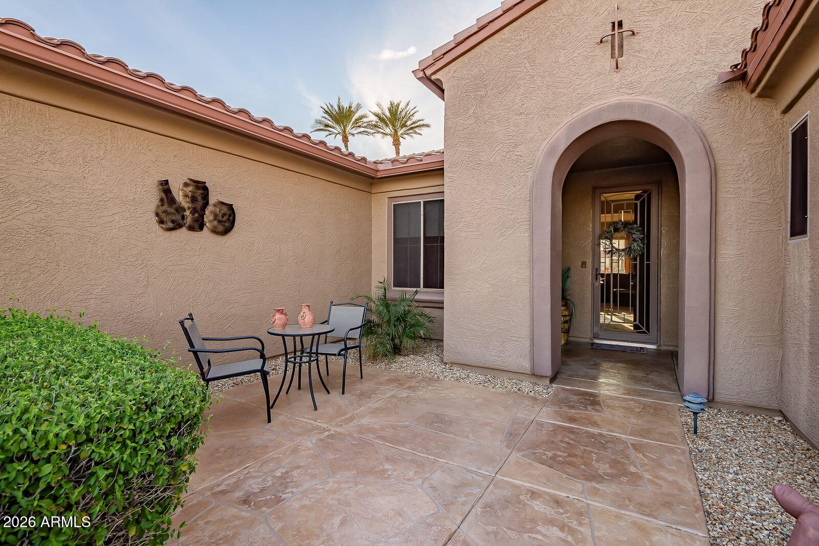 19848 North Rawhide Way Surprise, AZ 85387 - Photo 5 of 61 a view of a patio with table and chairs and potted plants