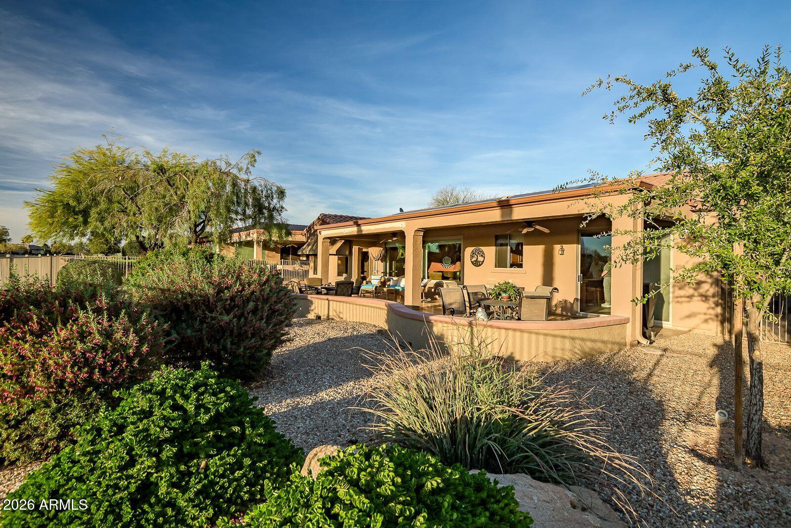 19848 North Rawhide Way Surprise, AZ 85387 - Photo 54 of 61 a view of a house with a yard