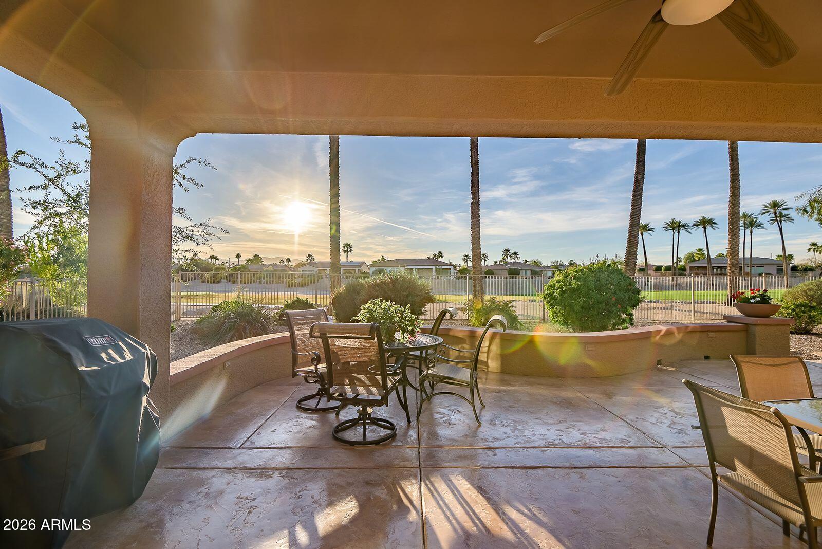 19848 North Rawhide Way Surprise, AZ 85387 - Photo 56 of 61 a view of a patio with dining table and chairs