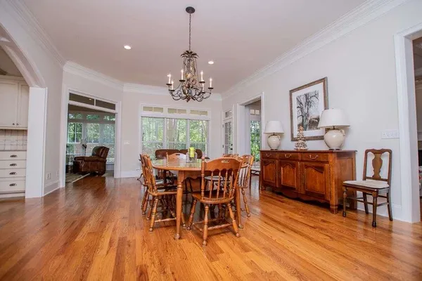 a view of kitchen and dining room with wooden floor
