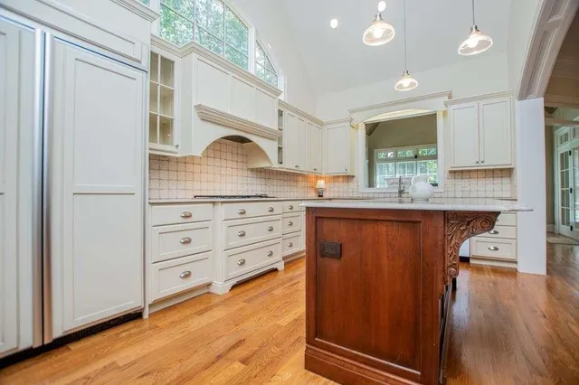 a kitchen with a sink cabinets and window