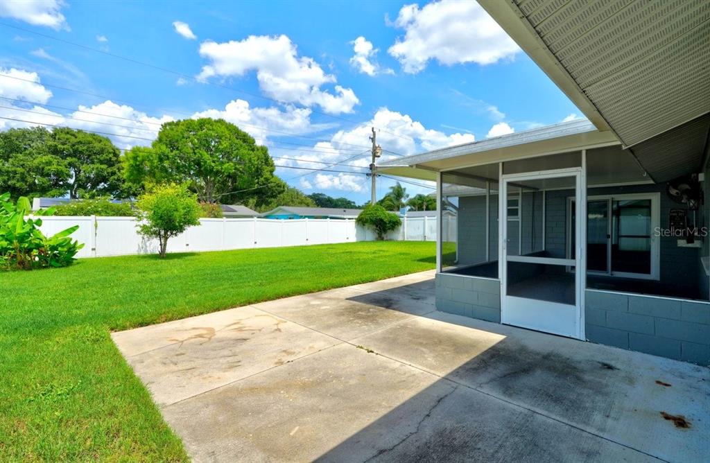 1309 Suwanee Road Daytona Beach, FL 32114 - Photo 23 of 33 a view of an house with backyard porch and garden