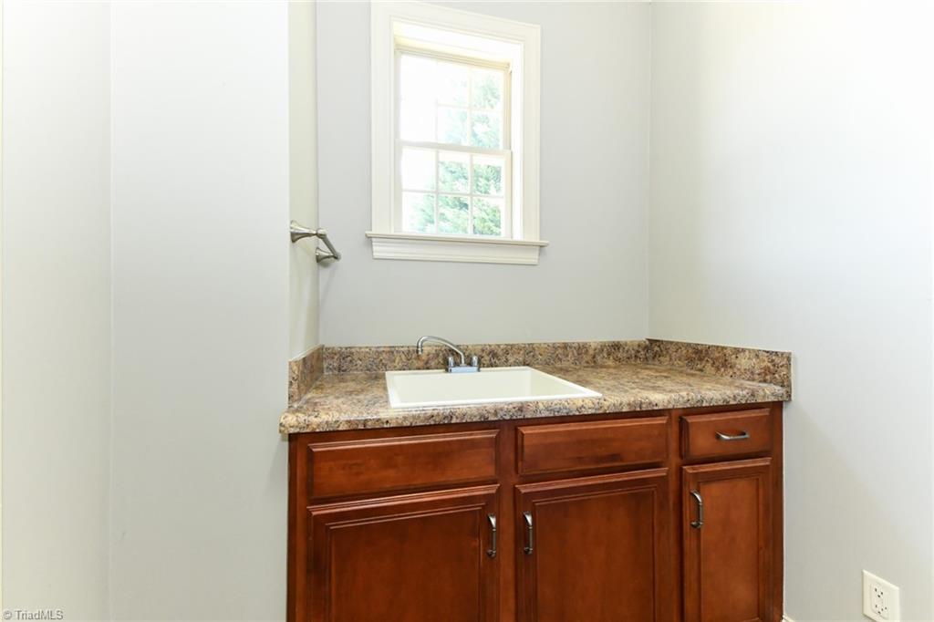 5718 Mabe Drive Oak Ridge, NC 27310 - Photo 16 of 39 Laundry Sink