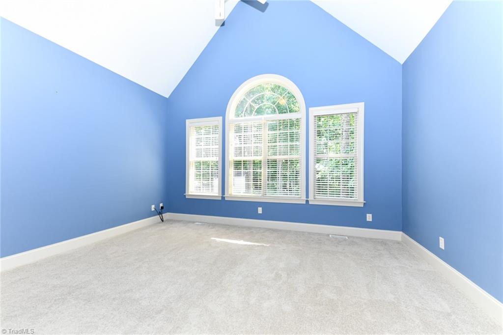 5718 Mabe Drive Oak Ridge, NC 27310 - Photo 18 of 39 Primary Bedroom