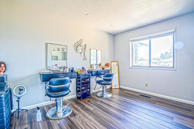 a living room with furniture a rug and a window