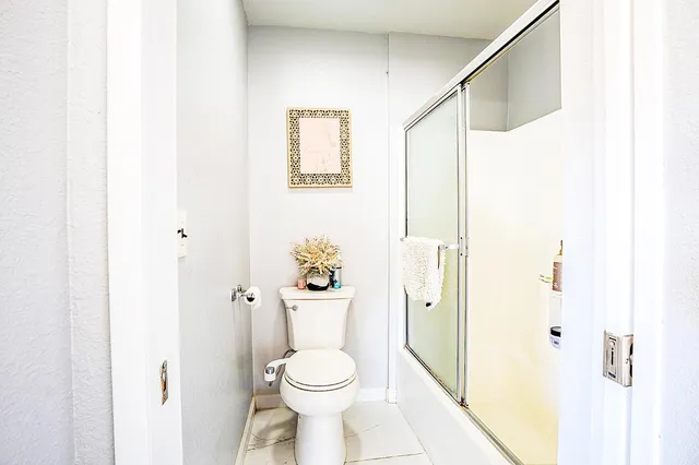 a view of a house with pool and a yard