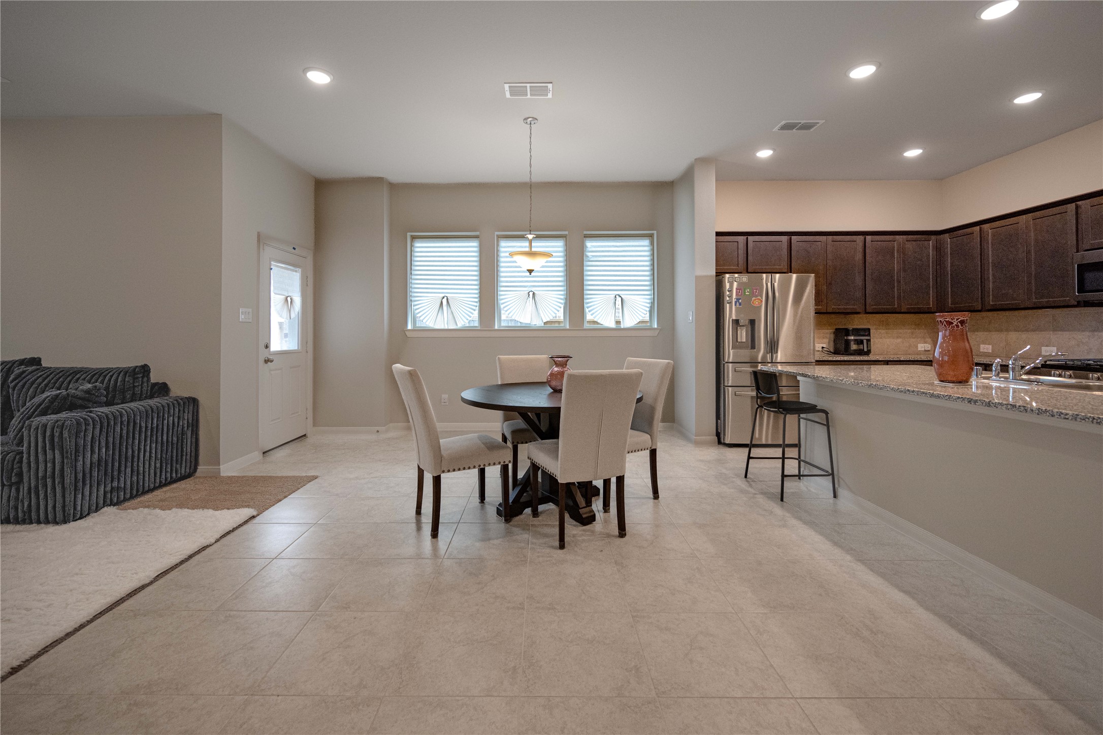 9026 Red Wolf Place Manvel, TX 77578 - Photo 5 of 17 a view of a dining room with furniture