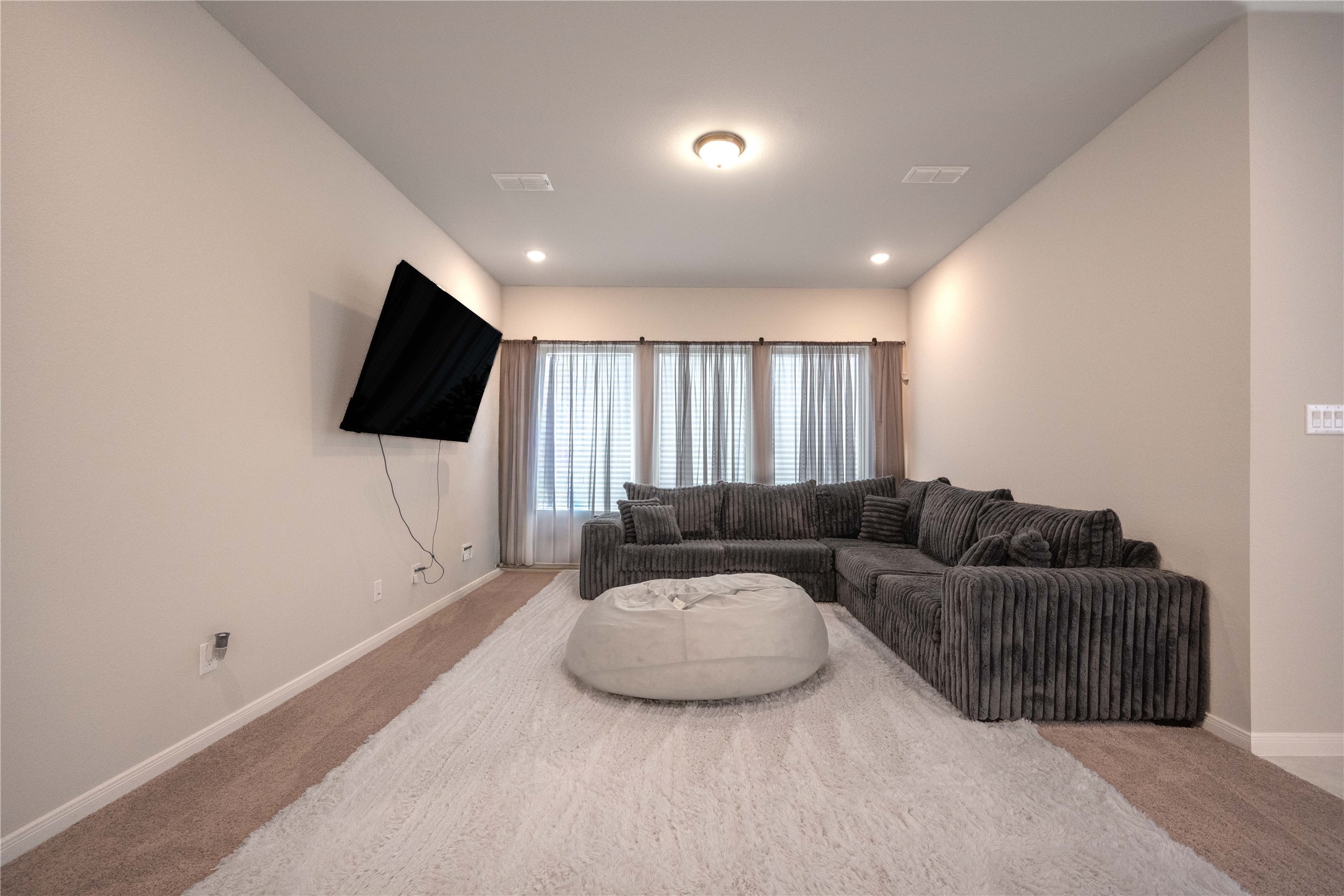 9026 Red Wolf Place Manvel, TX 77578 - Photo 7 of 17 a living room with furniture and a flat screen tv