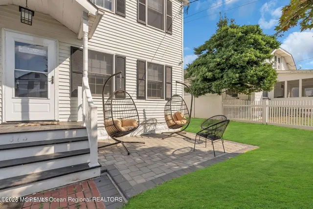 a backyard of a house with seating space