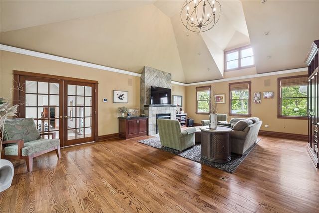 a view of entryway livingroom and hall with wooden floor