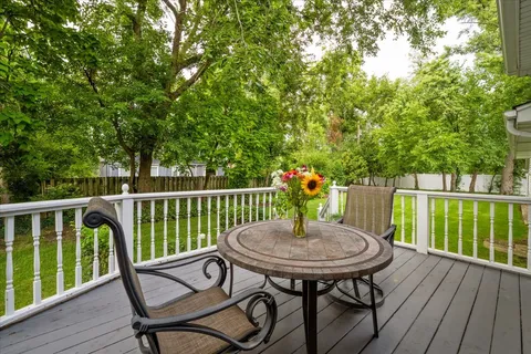 a view of a house with a yard and sitting area