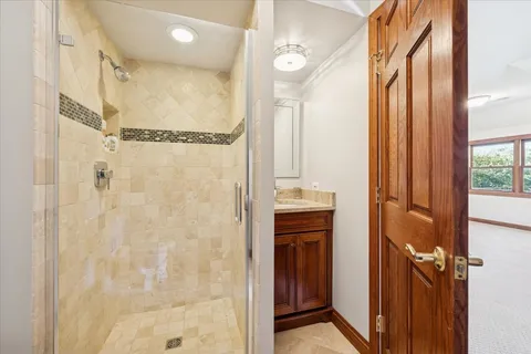 an empty room with wooden floor and closet