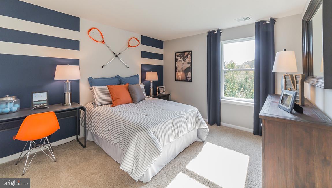 10 Moro Road Egg Harbor Township, NJ 08234 - Photo 23 of 42 a bedroom with a bed lamp and window