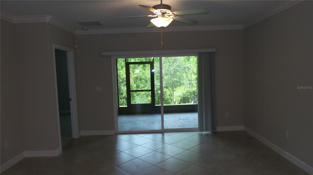 16715 Shell Bay Drive Land O Lakes, FL 34638 - Photo 15 of 19 a view of a livingroom with a ceiling fan and a window