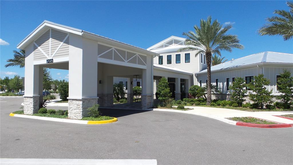 16715 Shell Bay Drive Land O Lakes, FL 34638 - Photo 17 of 19 a view of a house with swimming pool and a porch with furniture