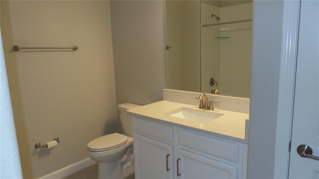 16715 Shell Bay Drive Land O Lakes, FL 34638 - Photo 8 of 19 a bathroom with a sink toilet and vanity