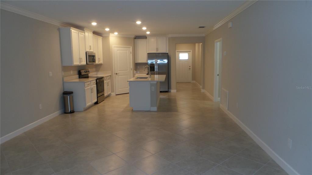 16715 Shell Bay Drive Land O Lakes, FL 34638 - Photo 10 of 19 a view of a kitchen with microwave and cabinets