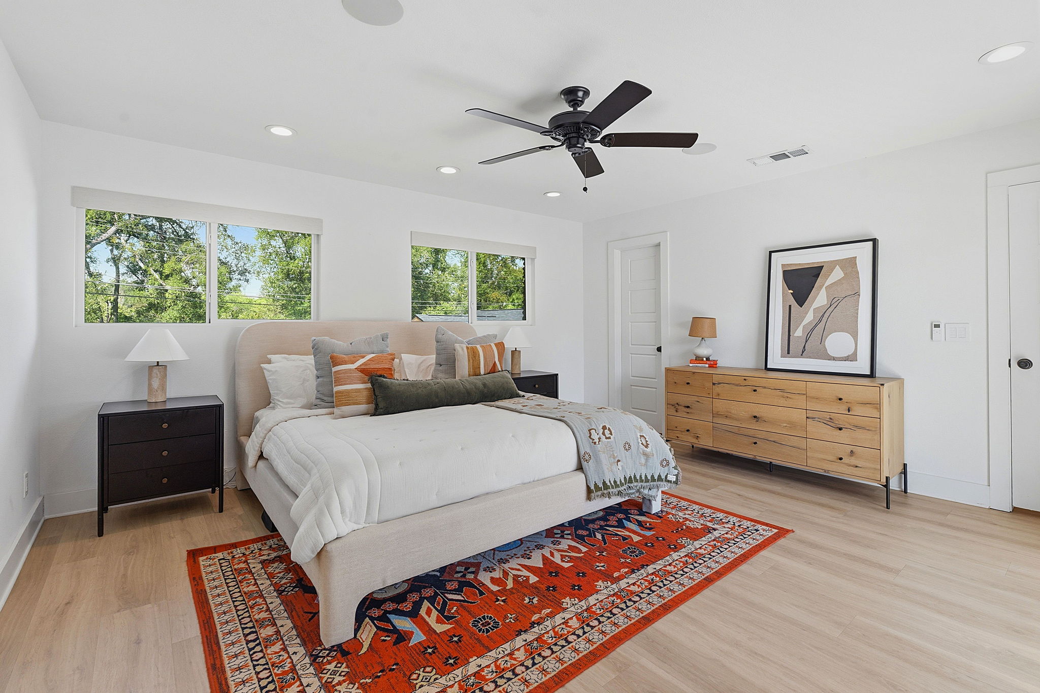 4403 Elmsgrove Drive Austin, TX 78721 - Photo 10 of 38 Recessed lighting and a ceiling fan provide ample illumination and comfort in this well-appointed bedroom.