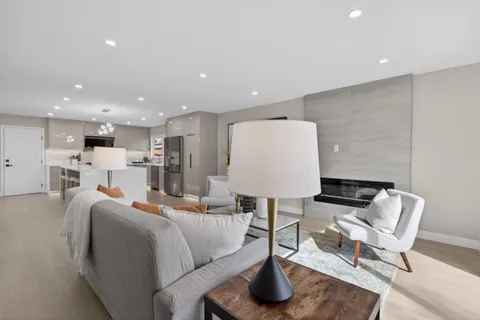 a living room with furniture and a table