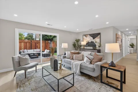 a living room with furniture and a lamp