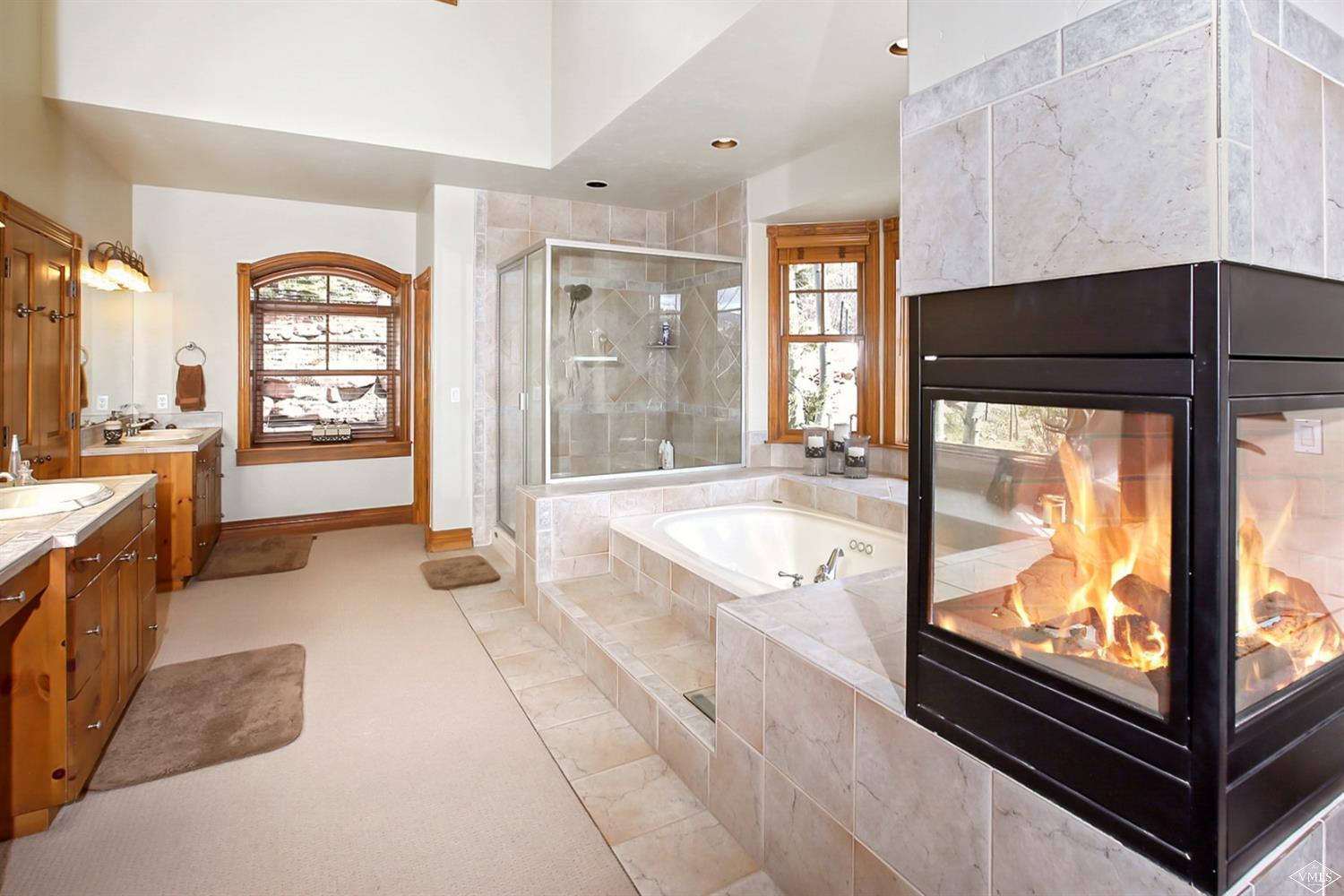 142 Spring Creek Lane Edwards, CO 81632 - Photo 11 of 25 a large kitchen with kitchen island a large window and stainless steel appliances