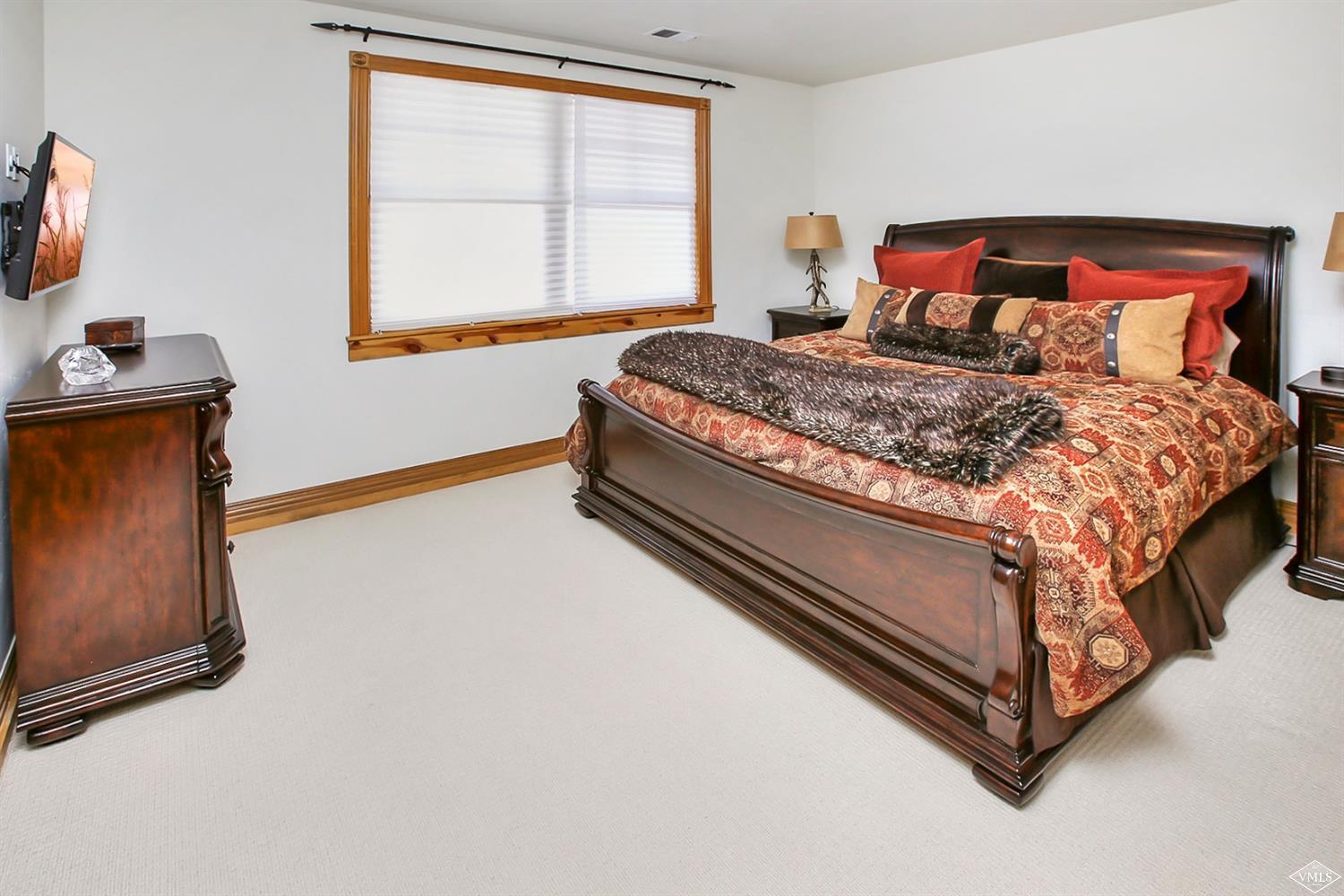 142 Spring Creek Lane Edwards, CO 81632 - Photo 17 of 25 a bed sitting in a bedroom next to a window