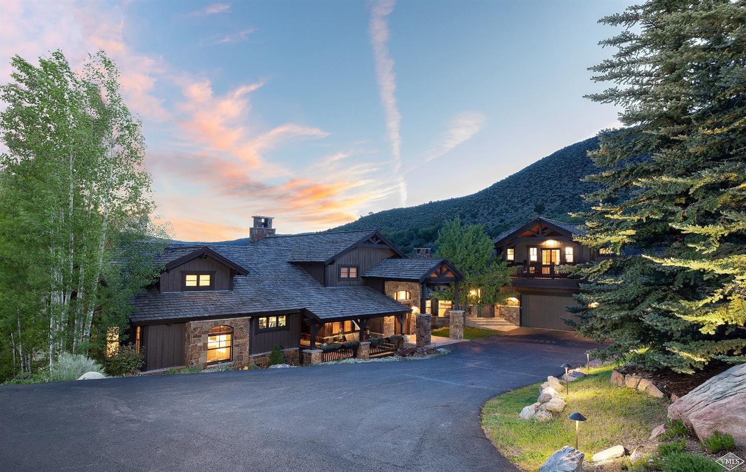 142 Spring Creek Lane Edwards, CO 81632 - Photo 2 of 25 a view of a big house with a big yard and large tree