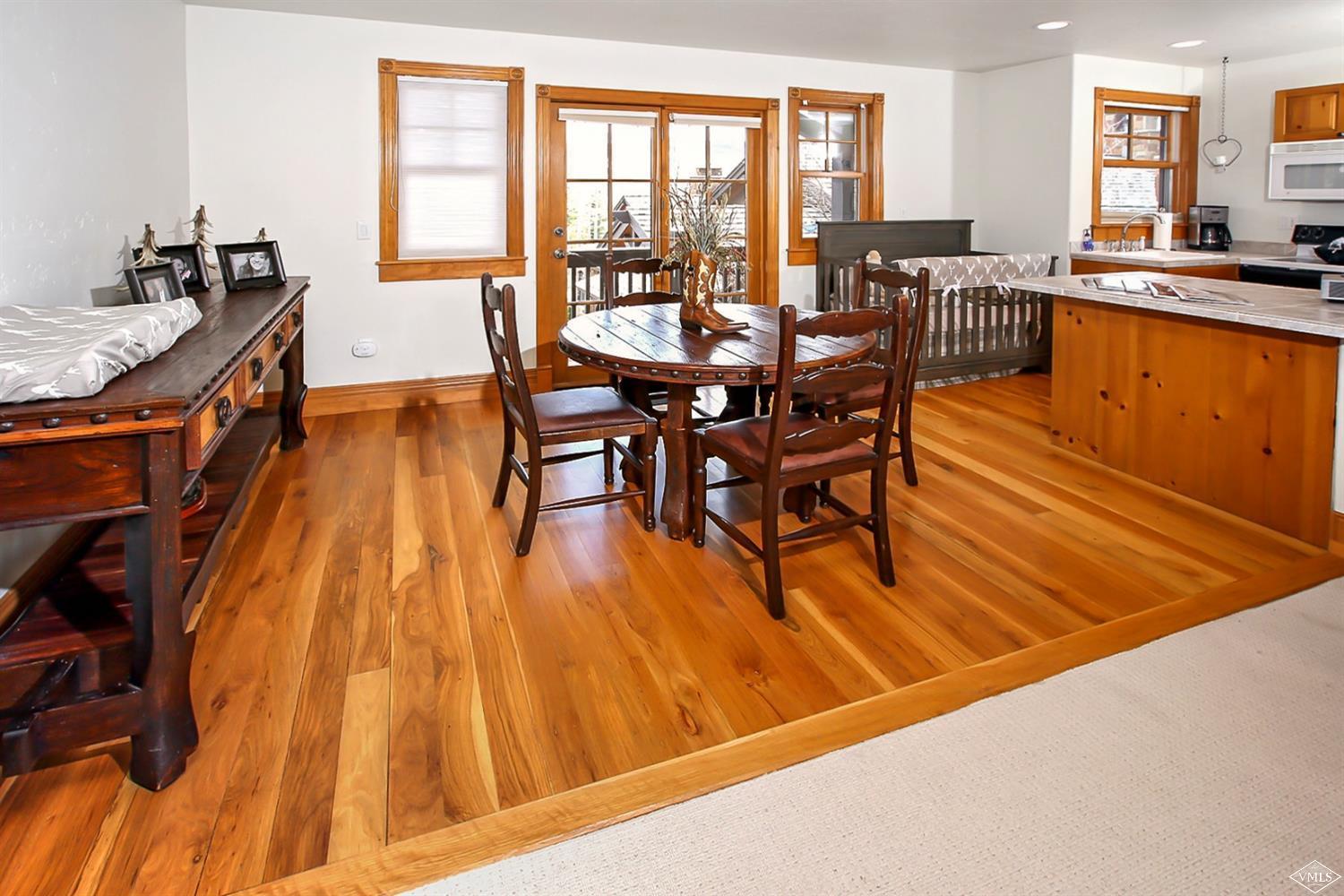 142 Spring Creek Lane Edwards, CO 81632 - Photo 21 of 25 a dining room with furniture and wooden floor