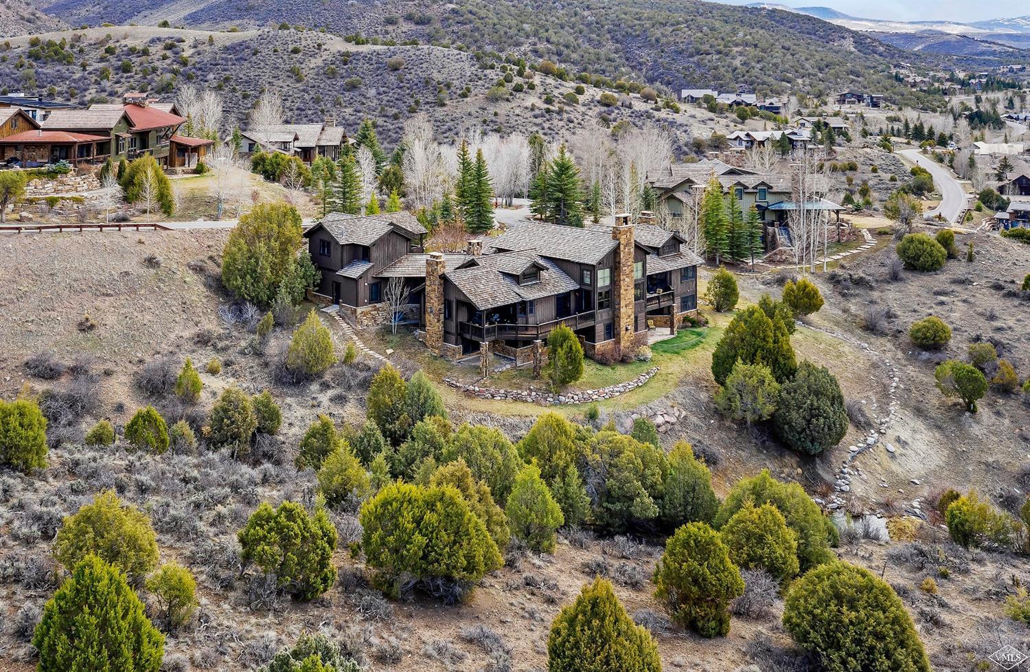 142 Spring Creek Lane Edwards, CO 81632 - Photo 25 of 25 a view of a chairs and table in a backyard