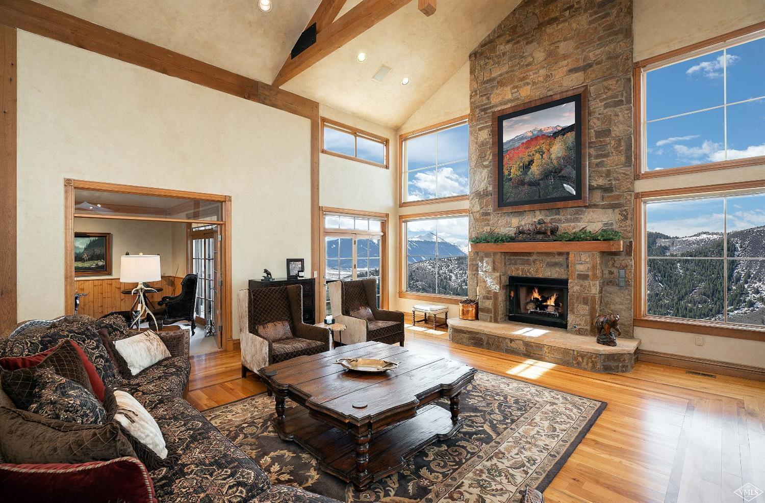 142 Spring Creek Lane Edwards, CO 81632 - Photo 3 of 25 a living room with furniture and a fireplace